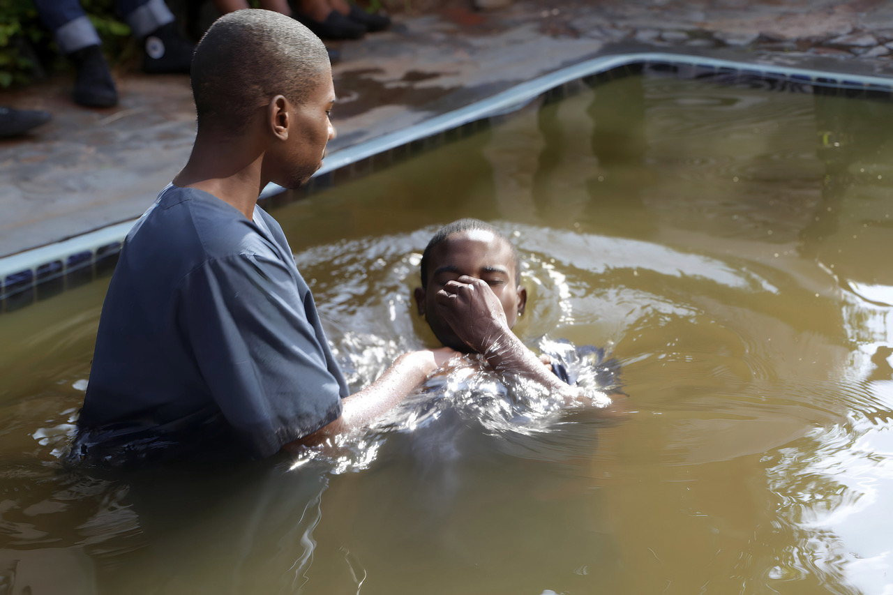A new believer being baptised