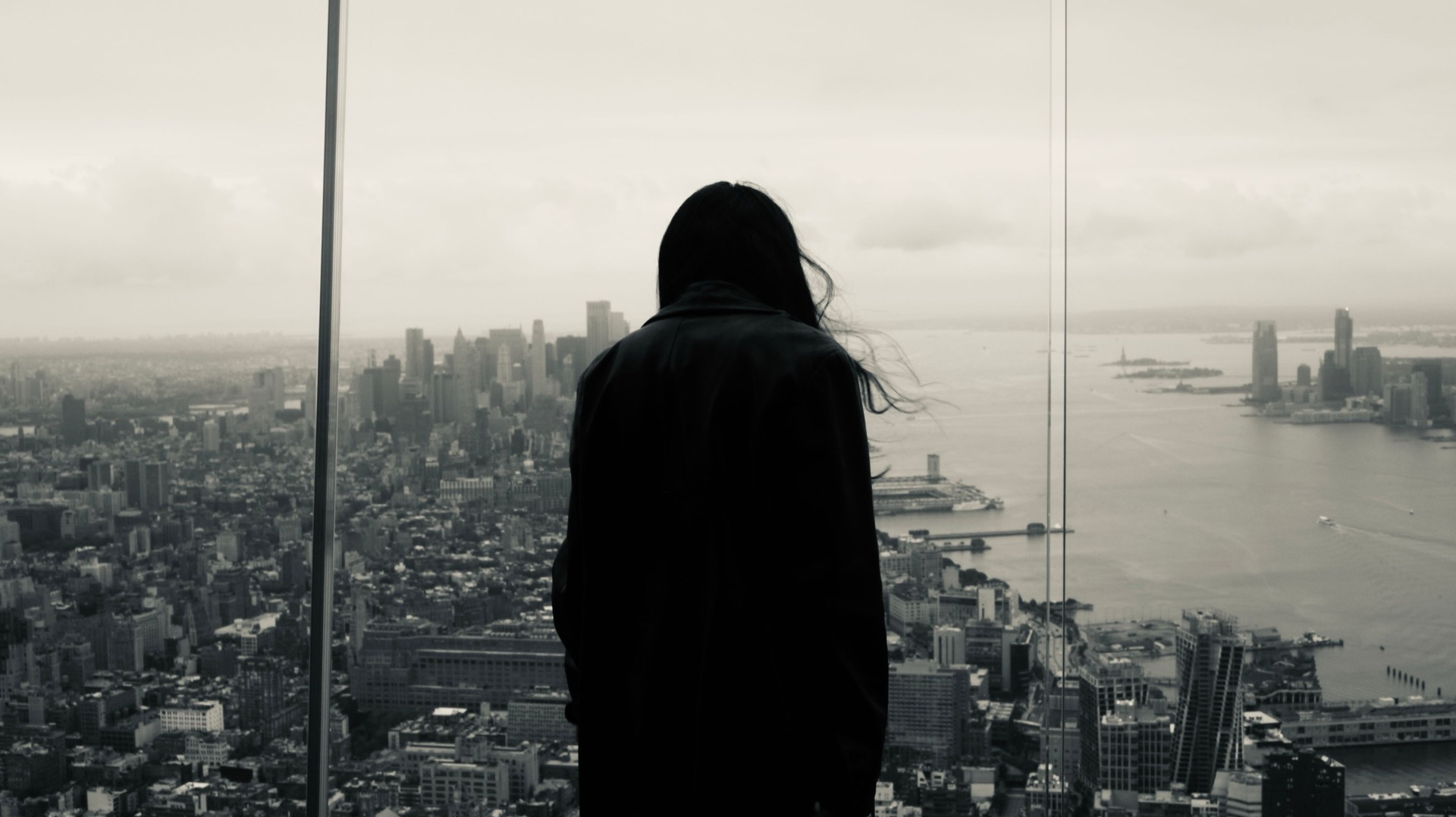 A leader looking out over a sprawling city